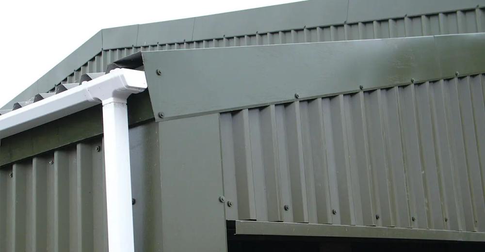 Custom steel fascia trims seal off the design of this lean-to