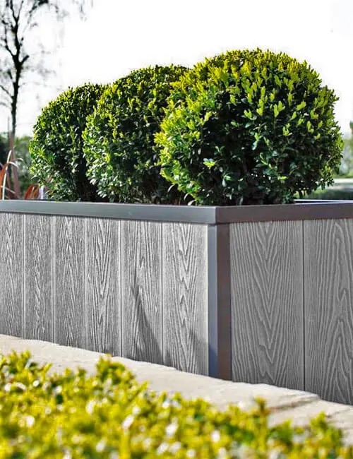 Two-tone Grey Composite Decking Boards are used to improve this garden.