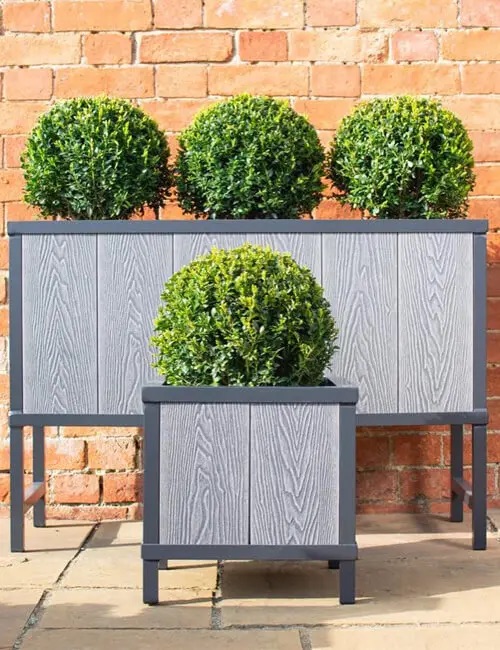 Two-tone Grey Composite Decking Boards are used to improve this garden.