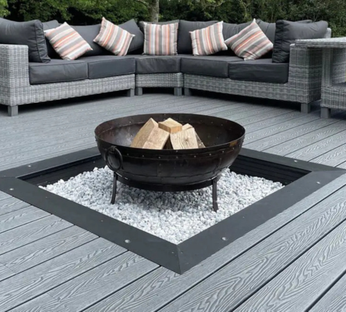 Picture frame effect: Stone Grey Woodgrain Composite Decking with a Bullnose Board Centrepiece for a firepit