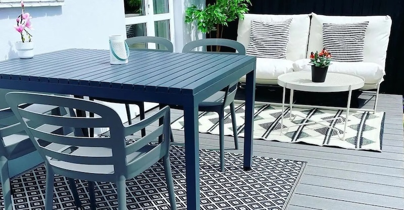 outdoor seating area with rugs on composite decking