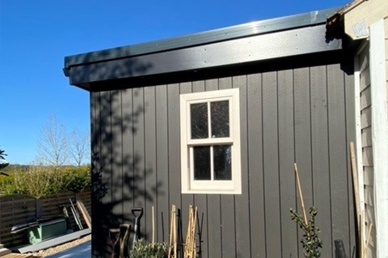 Composite Cladding creates a vertical exterior for this garden building