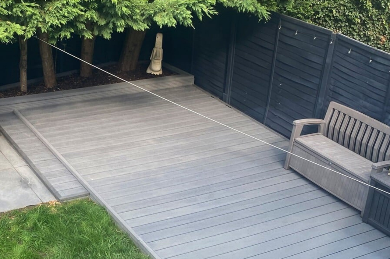 Cladco Composite Woodgrain Boards in Stone Grey make for a relaxing, raised decking in this garden