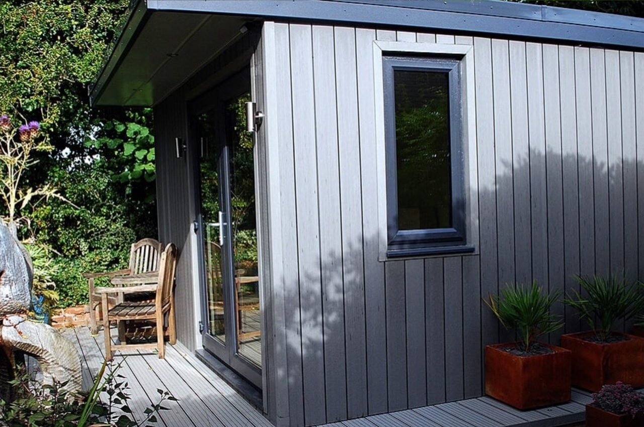 Stone Grey Composite Wall Cladding creates a warm and dry garden retreat.