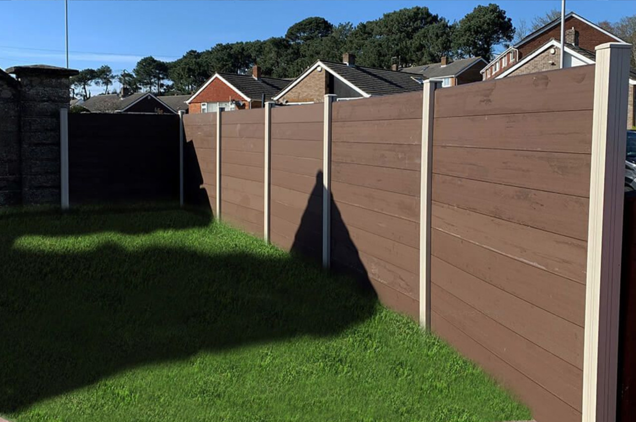 Coffee Fencing Panels contrast Ivory Fencing Posts in this garden