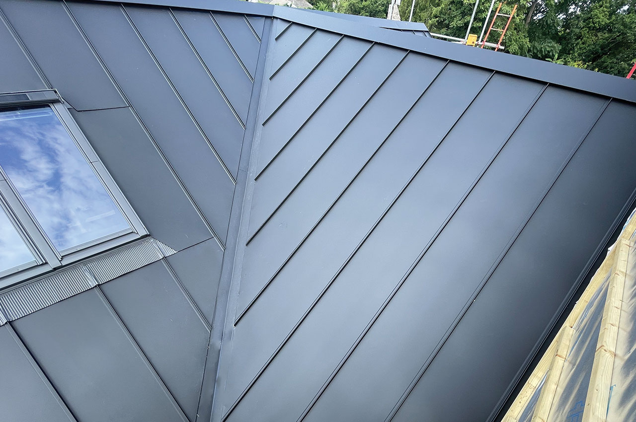 Contemporary Roof with Solar Panels and Roof Windows | Slate Grey Standing Seam Sheets
