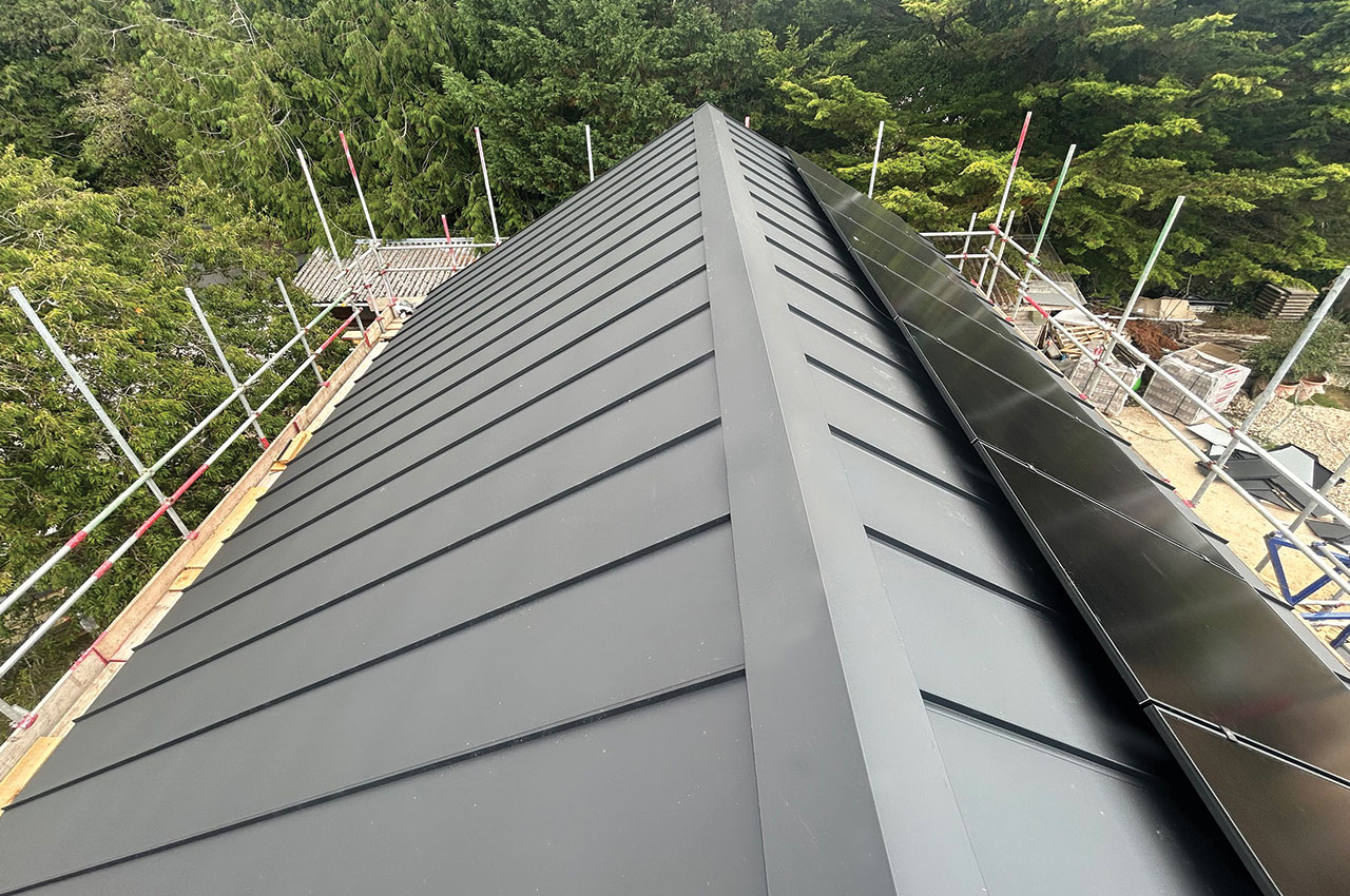 Contemporary Roof with Solar Panels and Roof Windows | Slate Grey Standing Seam Sheets