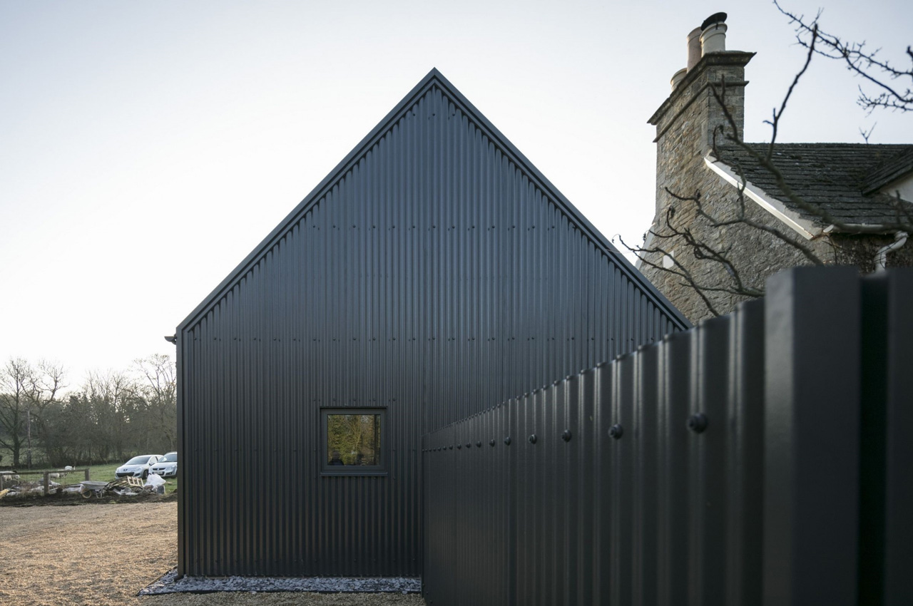 Corrugated Sheets in Anthracite with custom flashing detail around edging