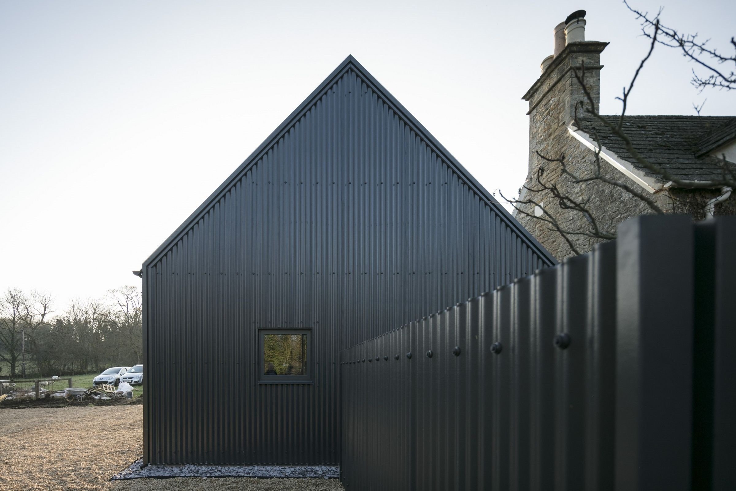 Corrugated Sheets in Anthracite with custom flashing detail around edging