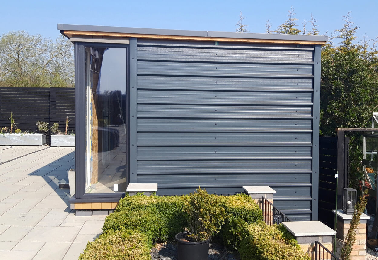 A modern garden building has been designed using 32/1000 Box Profile Roofing Sheets as side cladding
