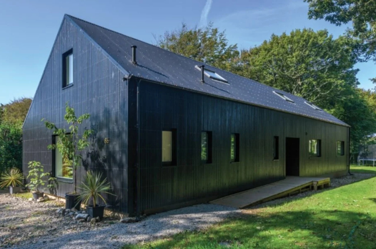 Cladco Corrugated Roofing Sheets in Black feature on this family home