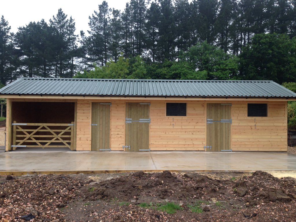 Stable Yard with added storage using Cladco Box Profile Roofing Sheets in Juniper Green