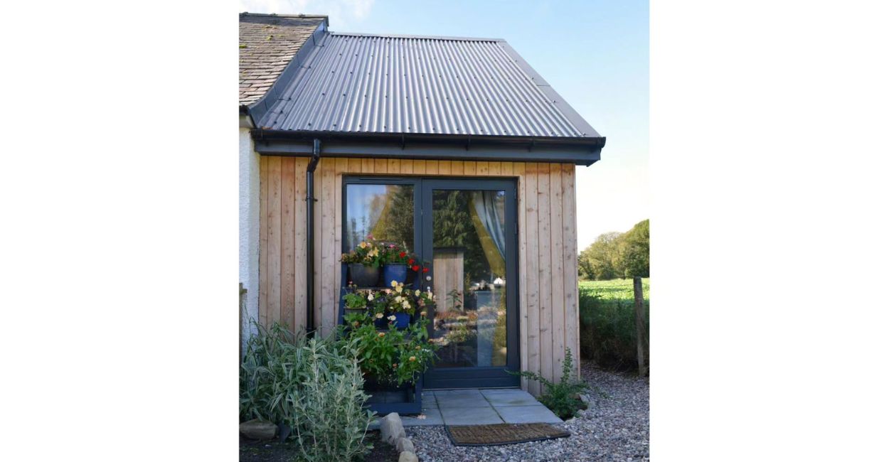Home extension featuring Cladco 13/3 Corrugated Roof with Anthracite PVC Plastisol Coating