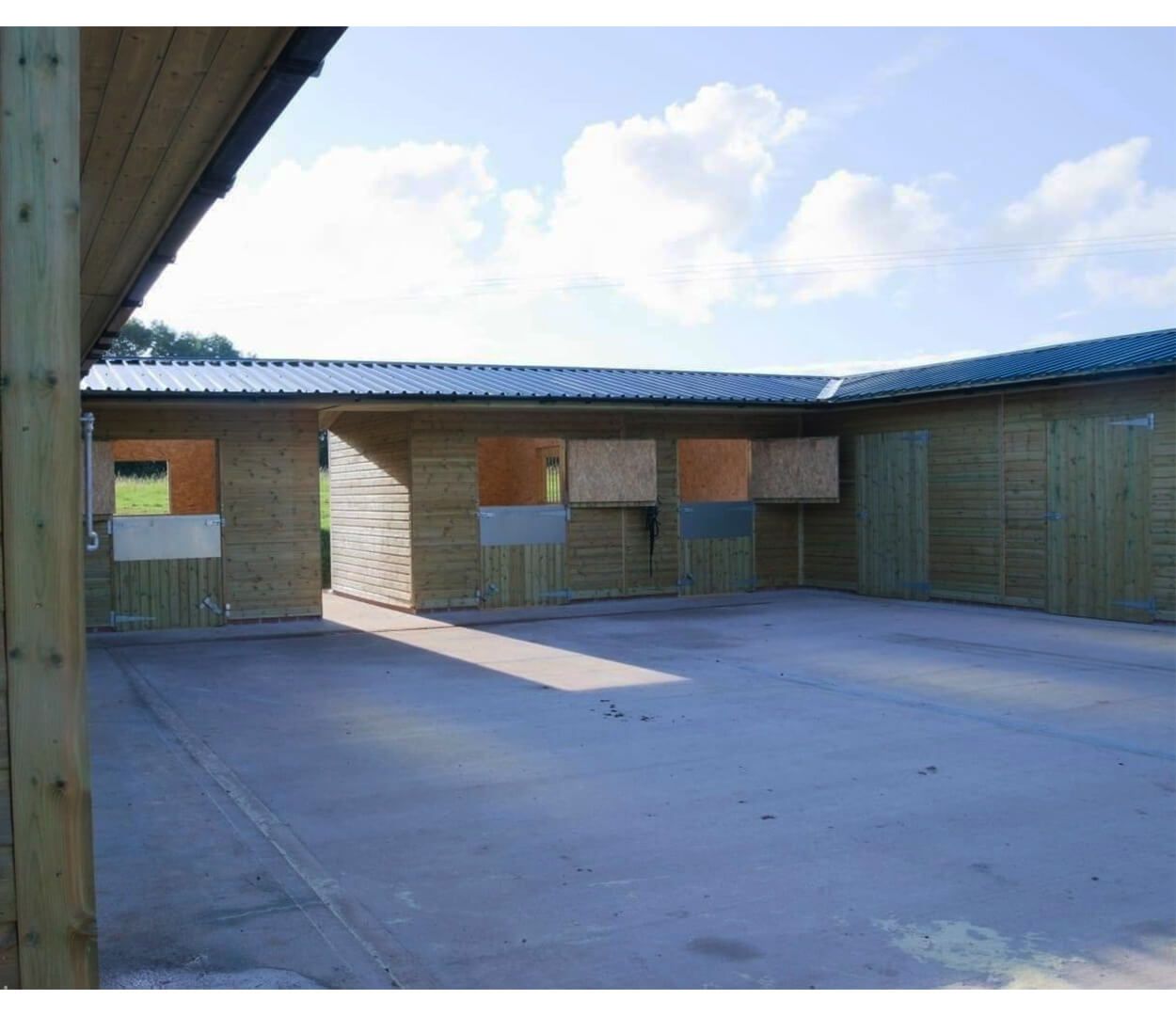 PVC Juniper Green roofing sheets give this stables a modern, yet culturally sound look without impeaching on the surrounding countryside