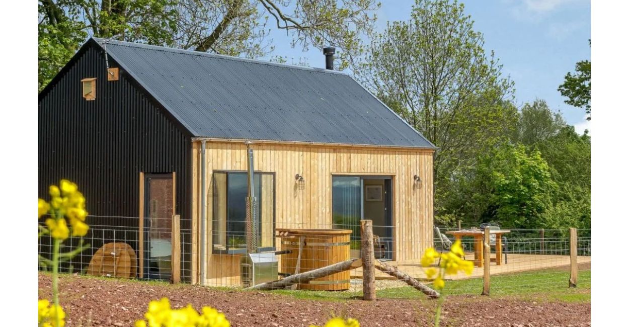 Cladco Anthracite Corrugated Roofing creates this stunning cabin.