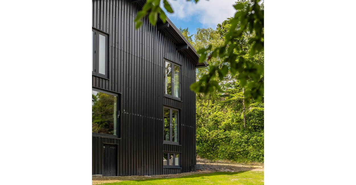 Cladco 32/1000 Box Profile Roofing Sheets in Black protect this modern self-build home, The Spinney