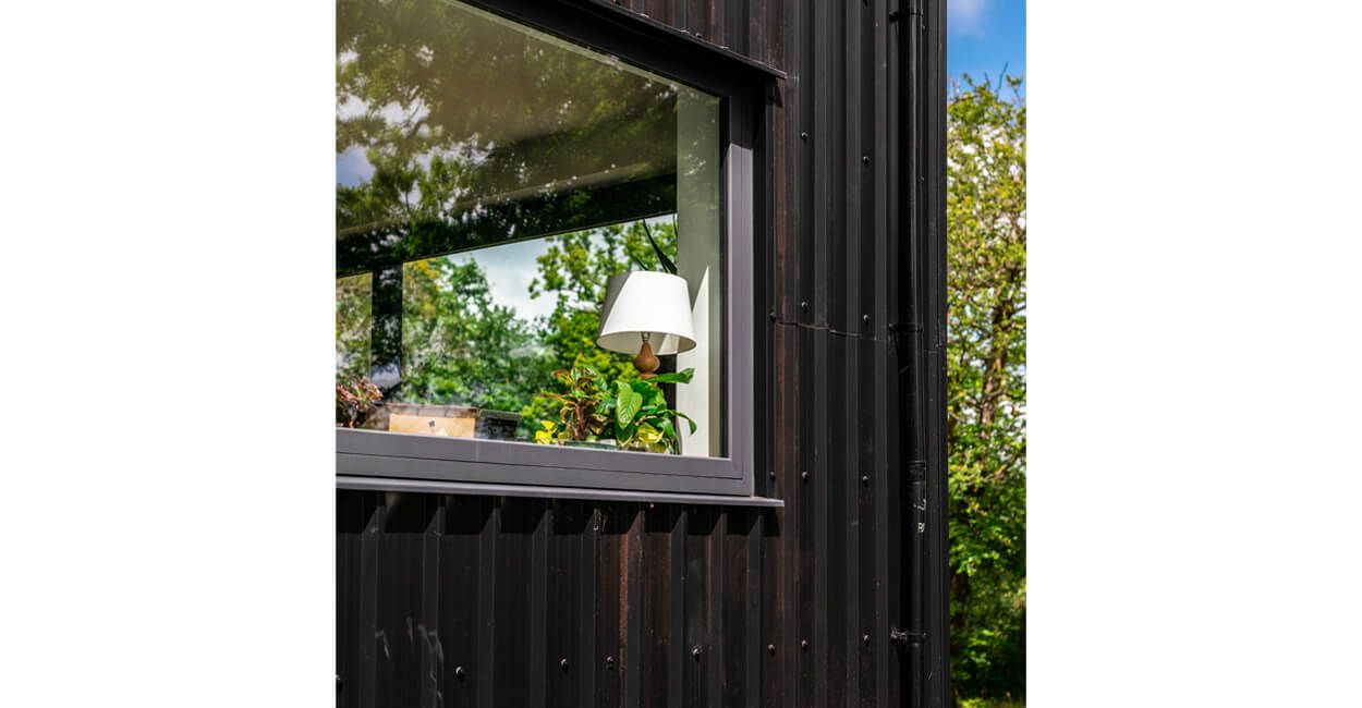 Cladco 32/1000 Box Profile Roofing Sheets in Black protect this modern self-build home, The Spinney