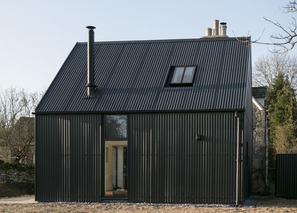 Corrugated Sheets in Anthracite with custom flashing detail around edging