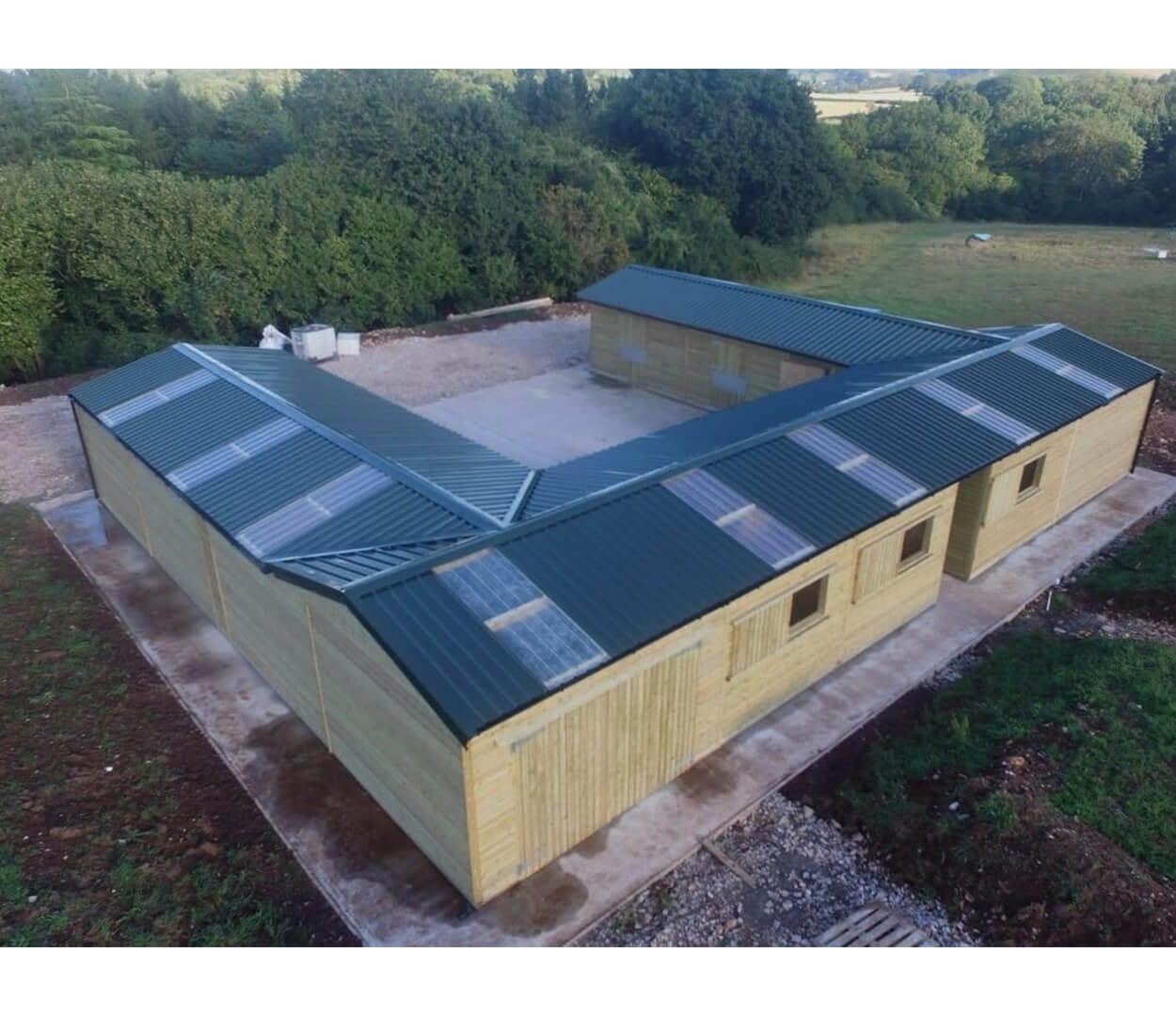 PVC Juniper Green roofing sheets give this stables a modern, yet culturally sound look without impeaching on the surrounding countryside
