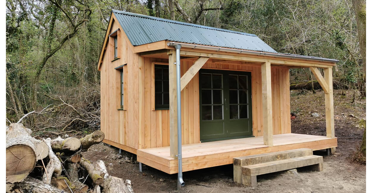 Off-grid woodland cabin featuring Cladco Corrugated Roof Sheets