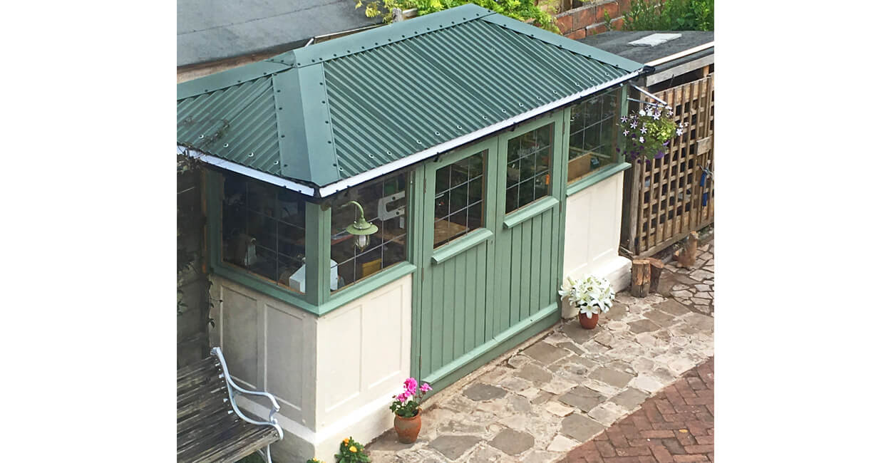 Juniper Green Corrugated Roofing Sheets on garden potting shed