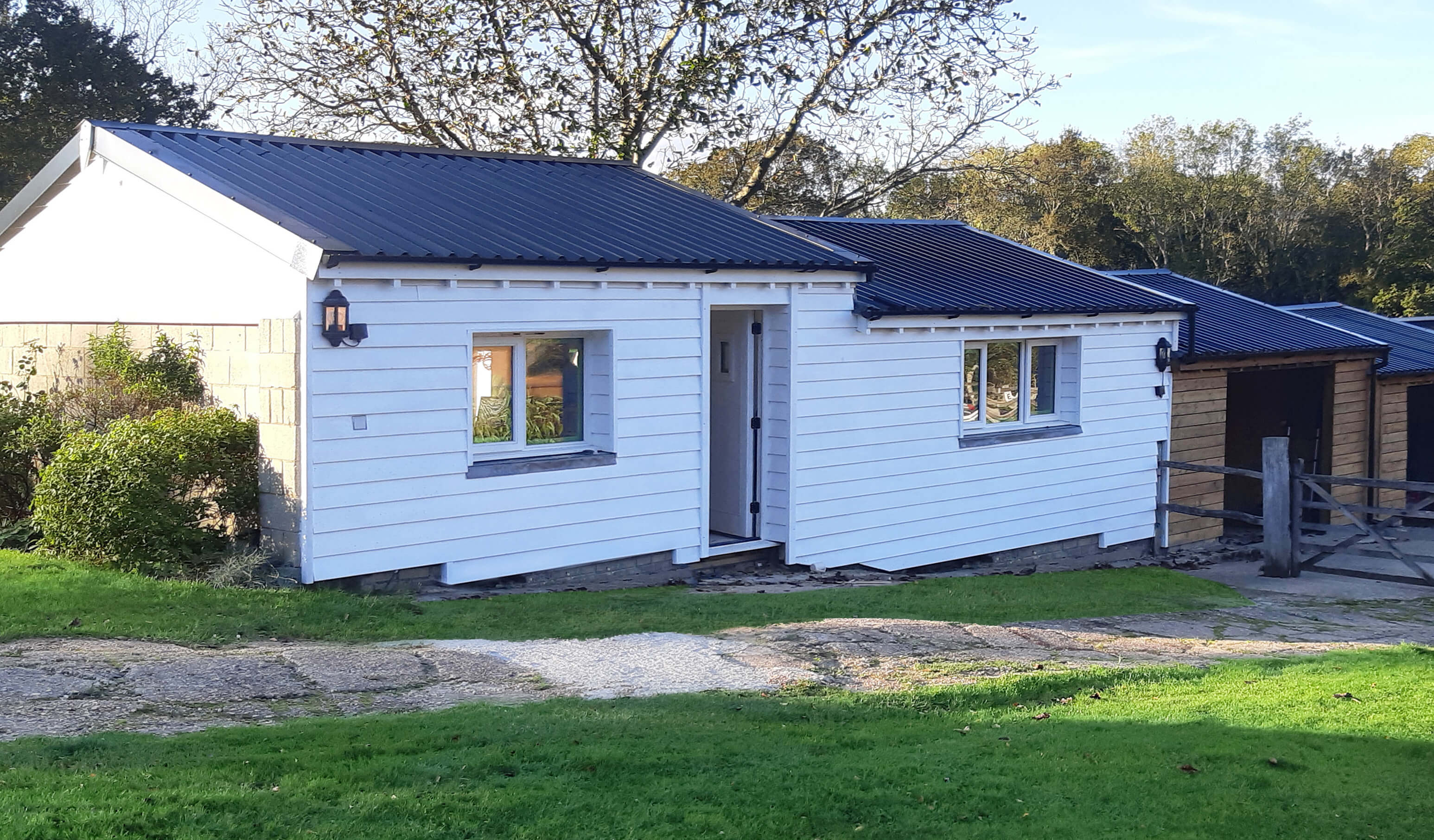 34/1000 Box Profile Sheets in Black feature on bungalows and barns in the countryside