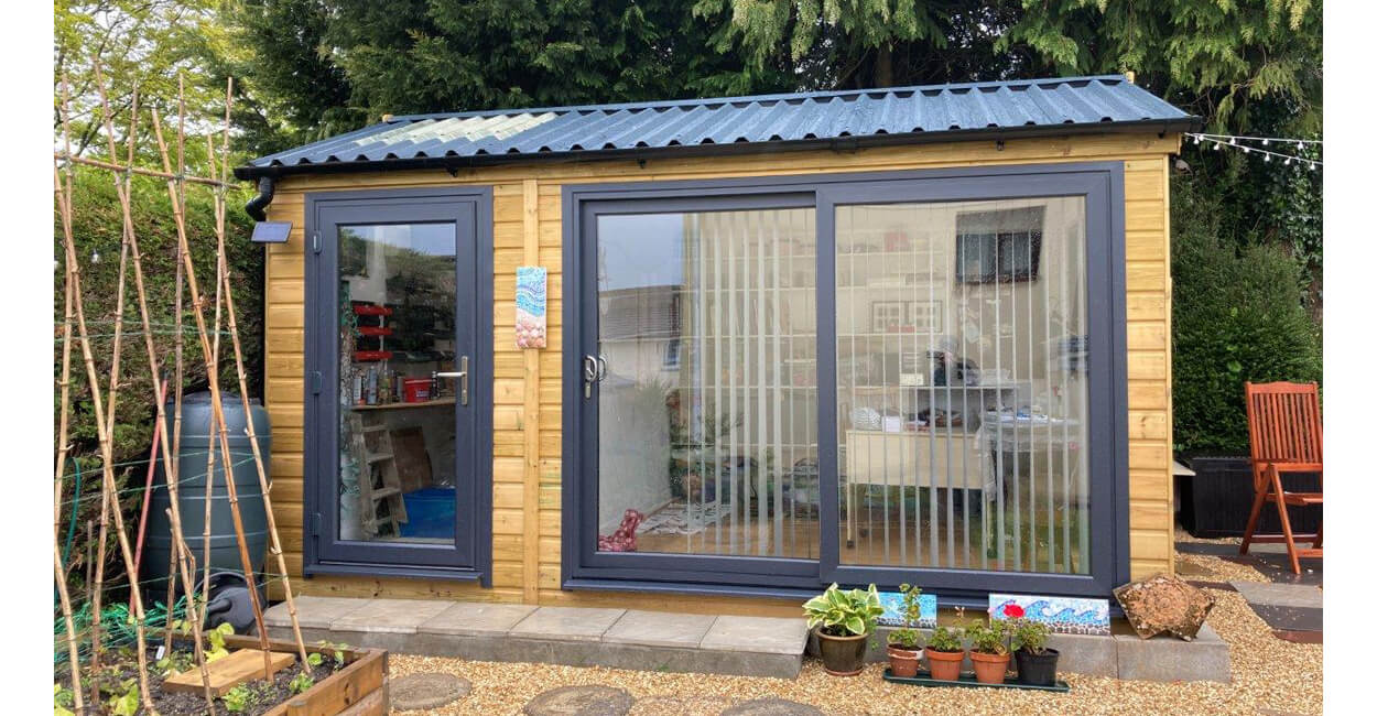 Impressive garden room completed using Cladco 34/1000 Box Profile Sheets in Anthracite colour