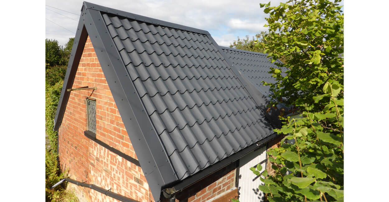 Graphite Grey Tile form sheeting on stone barn 