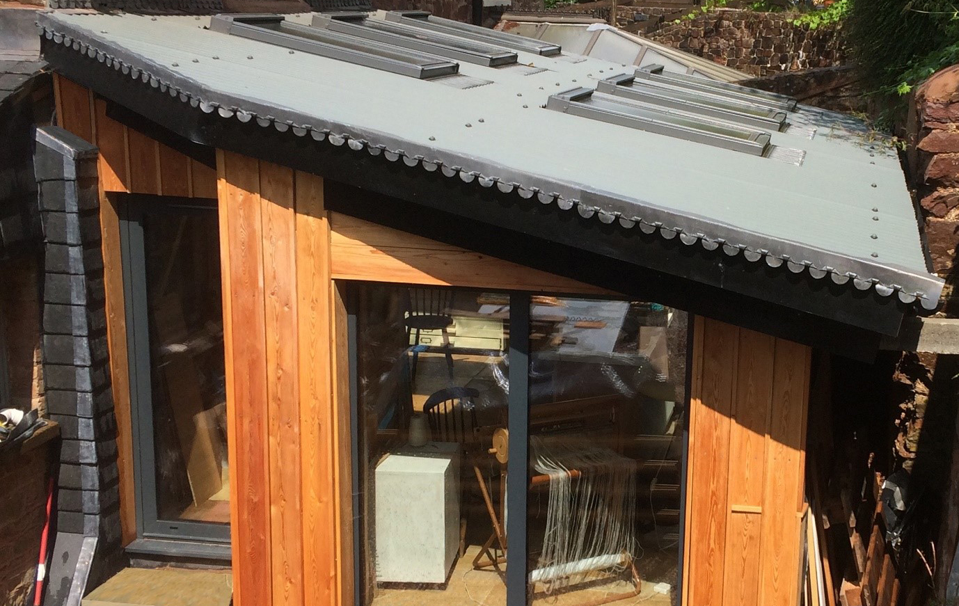 This Garden Studio was created using Cladco Bespoke Roofing sheets in light grey with Velux windows for extra light.