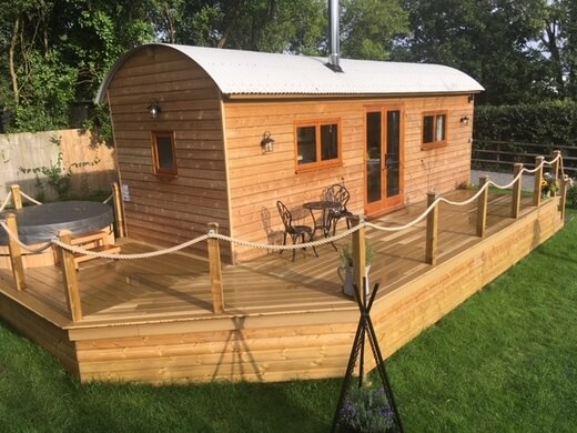 Timber shepherds hut on AirBnB using Cladco Composite Teak Decking Boards