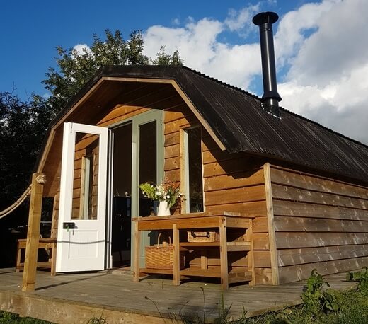 Timber clad hut using Cladco Corrugated Roofing Sheets in Black