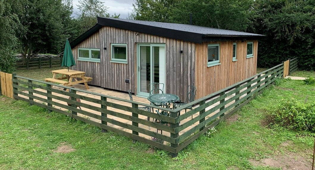 Holiday lodge with black Corrugated Roofing Sheets