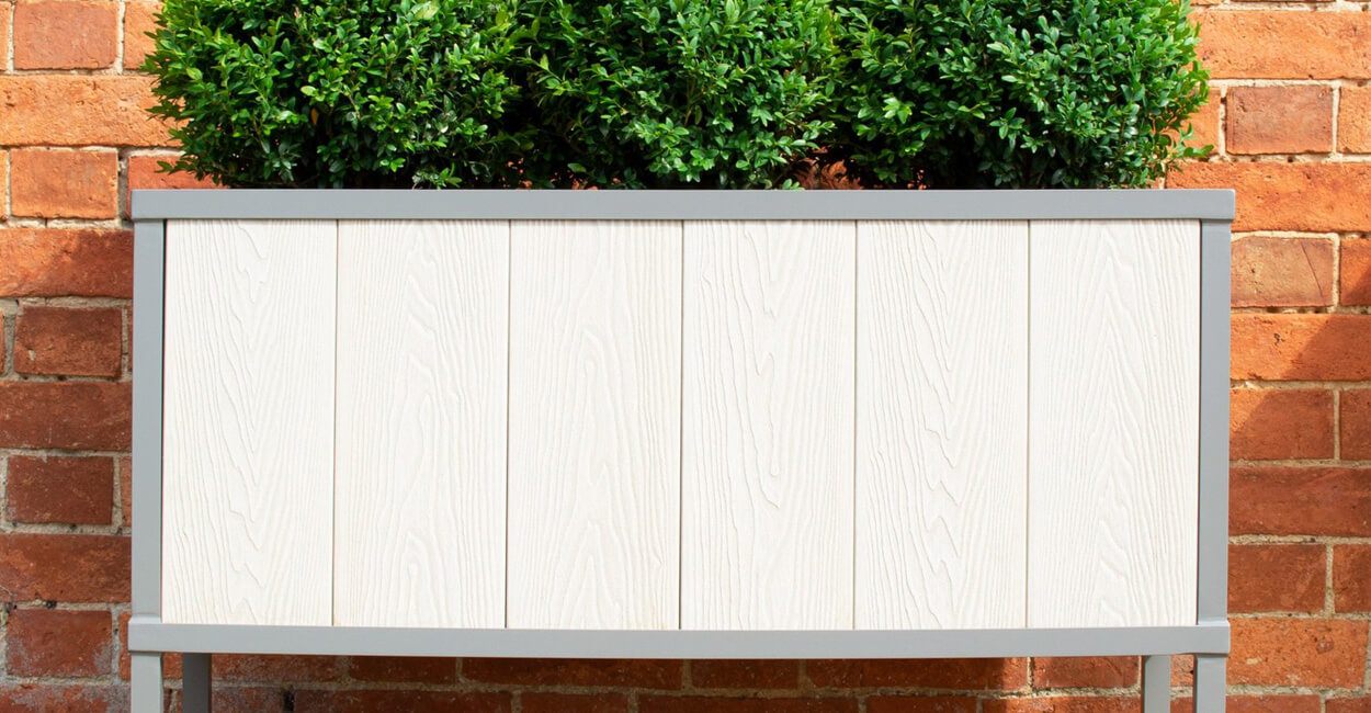 Two-tone Grey Composite Decking Boards are used to improve this garden.