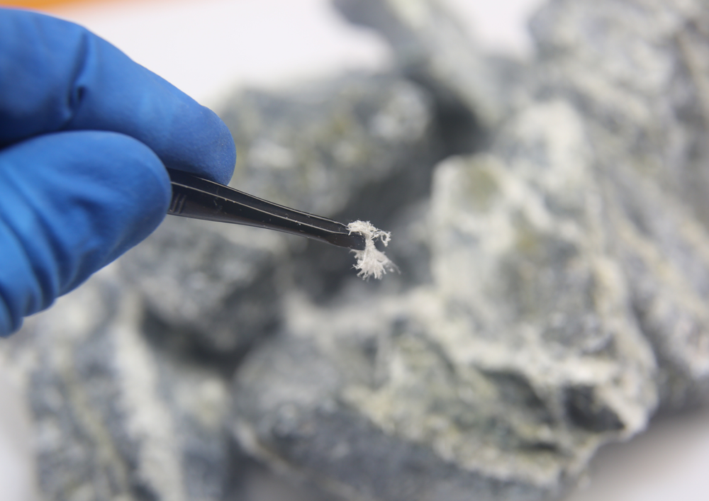 The tiny asbestos fibres that are mixed with cement to create asbestos roof sheeting material that was popular for its insulation and strength