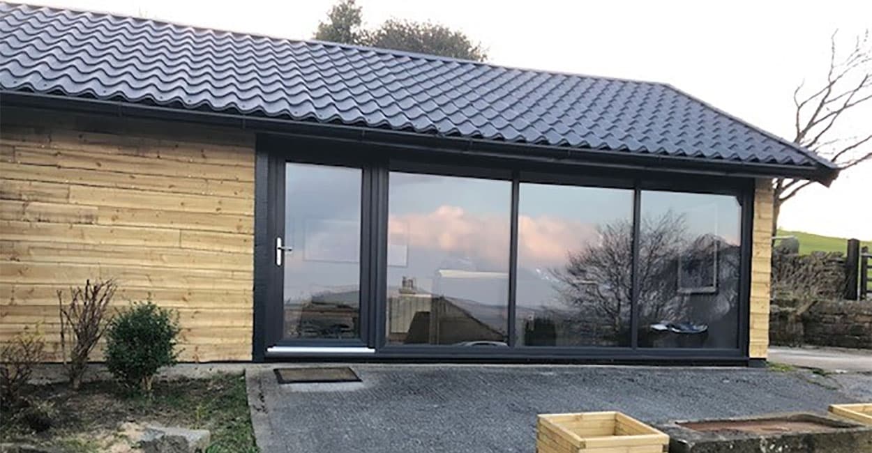 Cladco Tile Form Sheets are great for low profile roofing pitches and can be fitted easily around ground floor and first floor windows. Graphite Grey Tile Form Sheets