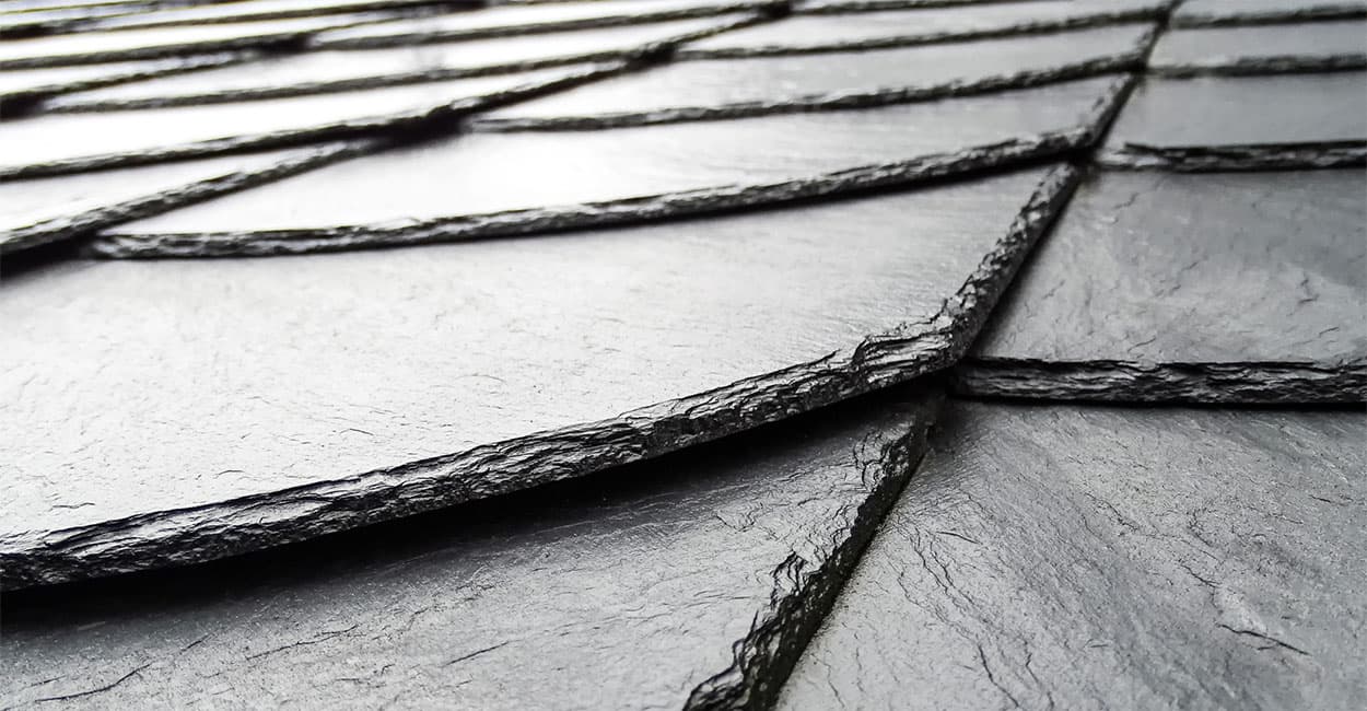 Slate tiles are best installed as a single lapping on a low pitch roof
