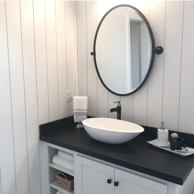 Shiplap panelling fitted vertically in a bathroom Shiplap panelling fitted vertically in a bathroom