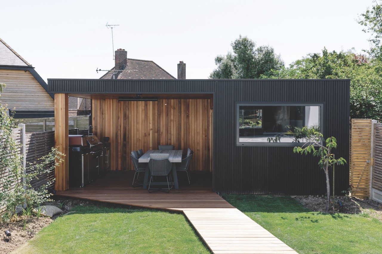 Charcoal slatted composite cladding used alongside timber cladding on modern garden room