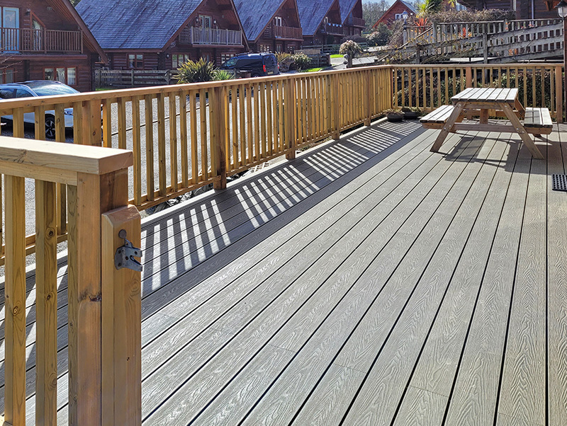 Cladco light grey signature composite decking installed on a raised balcony area.