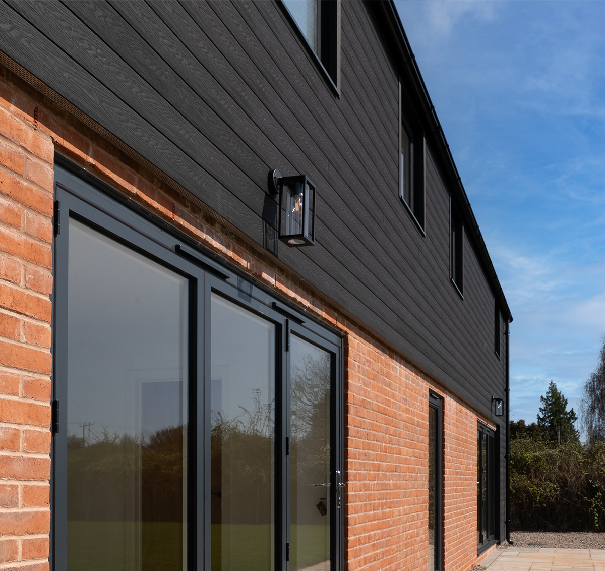 Cladco charcoal Signature composite cladding installed on this modern home.