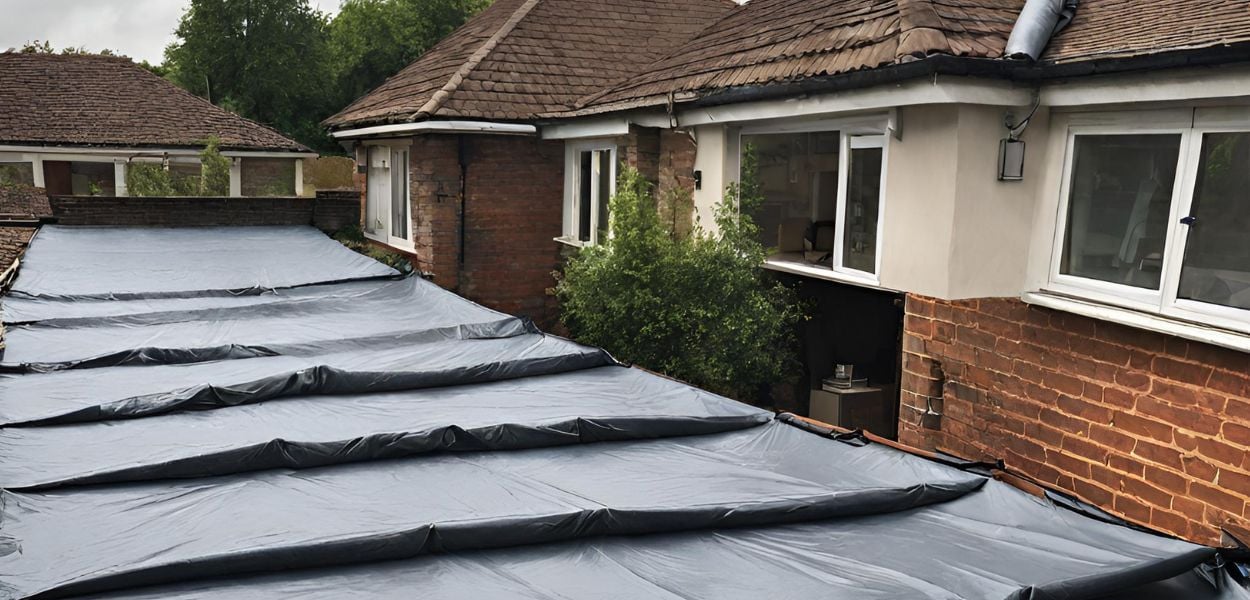 Tarpaulin covering a roof.