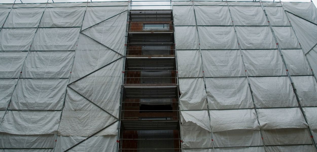 Tarpaulin on building scaffolding.