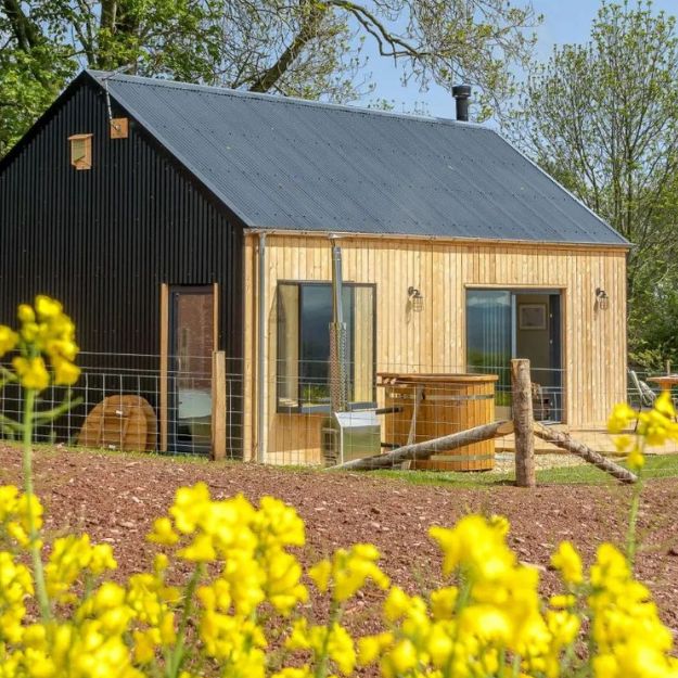 A contemporary yet traditional holiday let barn with Corrugated Roofing Sheets and Corrugated Cladding Sheets in Anthracite.