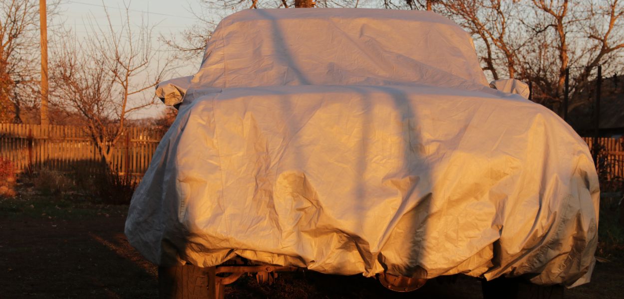 Tarp for covering a car