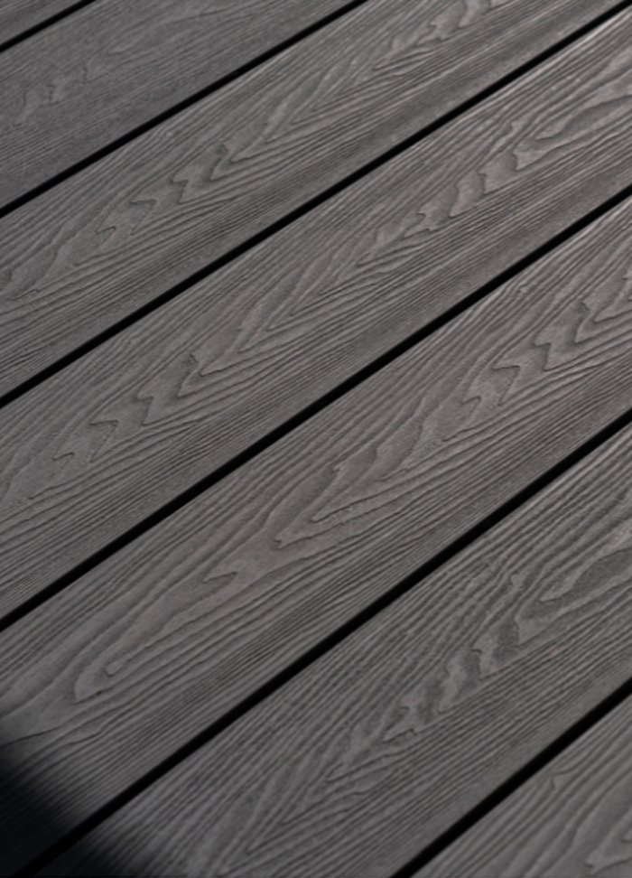 Close up of Composite Decking in a dark Charcoal colour.