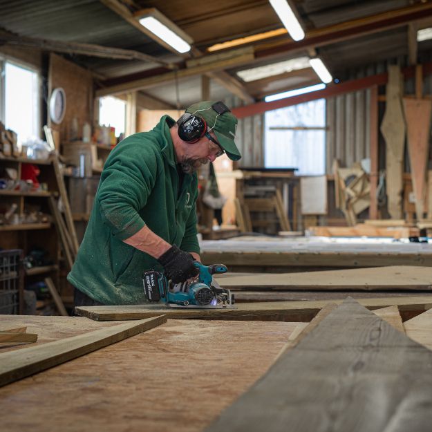 Shields Building Staff cutting materials