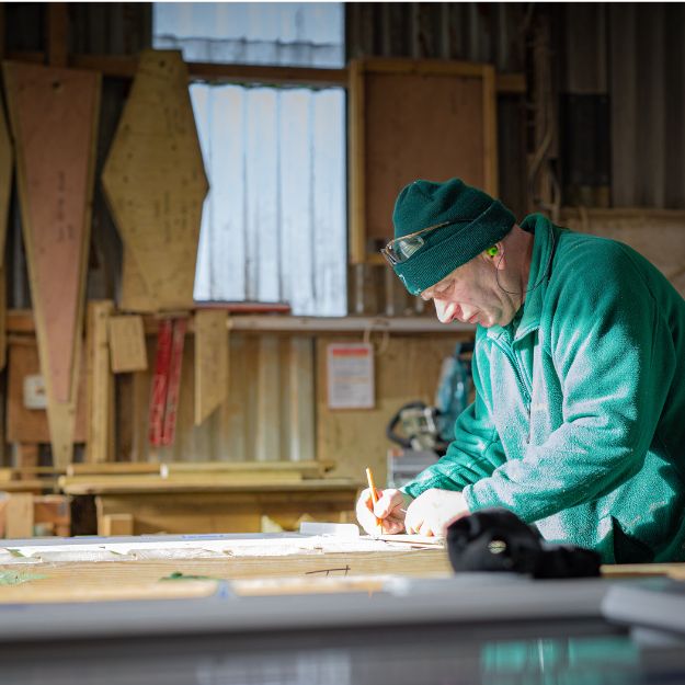 Shields Building Staff cutting materials