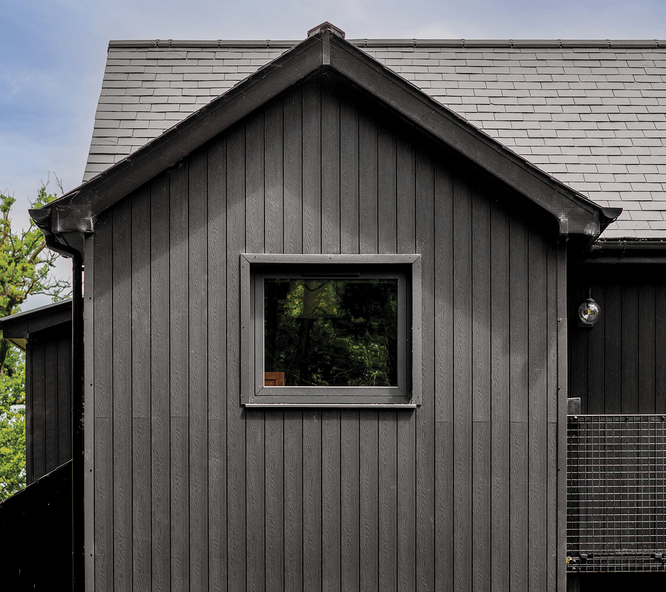 Composite cladding boards in dark grey