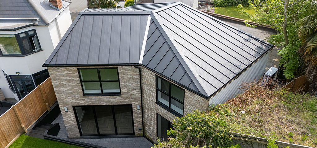 Back garden view of the modern South East London home featuring Cladco standing seam roofing sheets.
