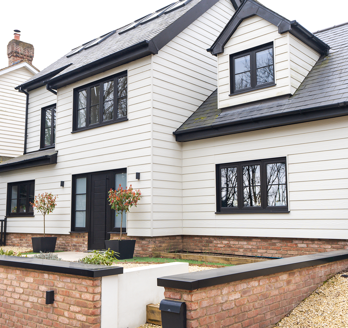 Cladco fibre cement lap cladding boards in cream installed on this modern home renovation.
